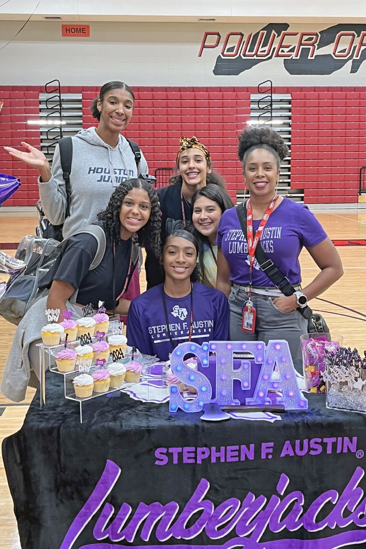 Langham Creek High School senior Kennedy Jones, seated, signed a letter of intent to play volleyball at Stephen F. Austin.